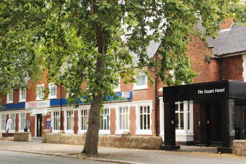 a building with a sign in front of it at The Stuart Hotel, Sure Hotel Collection by Best Western in Derby