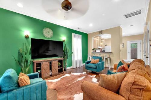 a living room with a couch and a tv at Cozy 2B Townhouse - Hot Tub in Concord