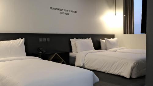 Postel nebo postele na pokoji v ubytování Hotel Cappuccino