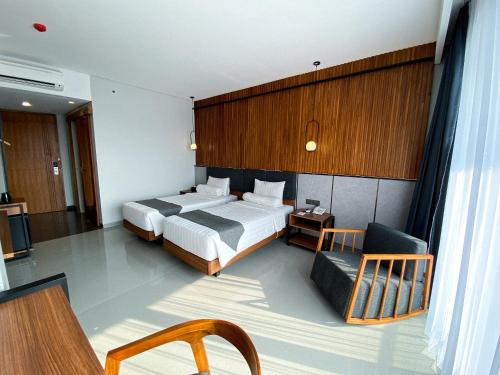 Postel nebo postele na pokoji v ubytování Nata Azana Hotel Ngawi