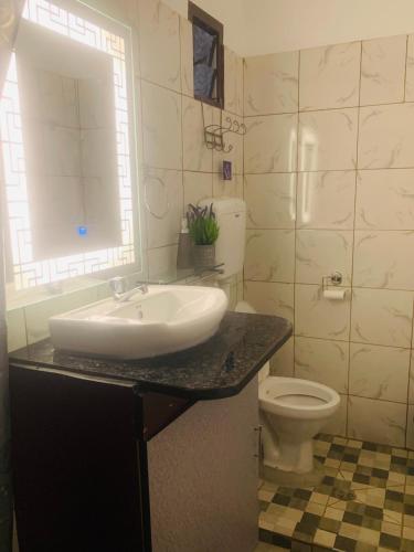 a bathroom with a sink and a toilet at Comfortable Accommodation in Lautoka