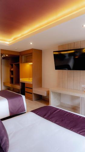 Postel nebo postele na pokoji v ubytování Hotel Andesmar Huancayo