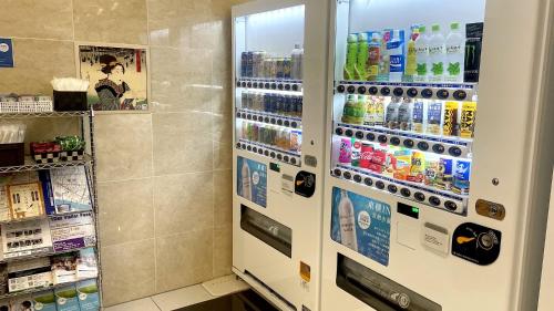 a refrigerator filled with lots of drinks in a store at Toyoko Inn Tokyo Asakusa Kuramae No.2 in Tokyo