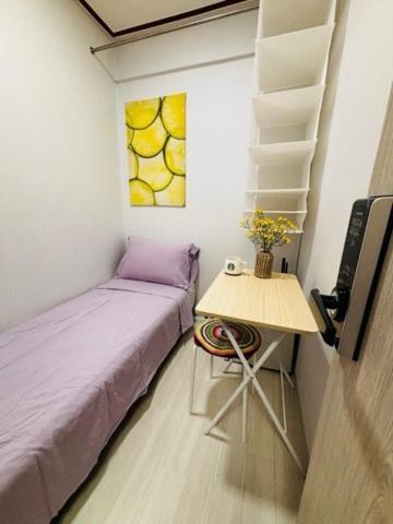 Postel nebo postele na pokoji v ubytování Tanhyun Rodeo Suite Livingtel
