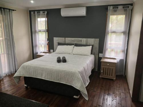 Katil atau katil-katil dalam bilik di Hippo Waterfront Lodge
