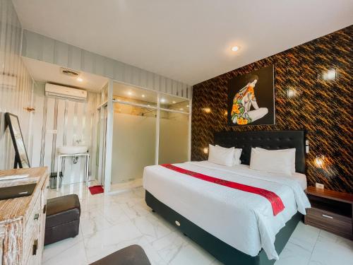 a bedroom with a large bed in a room at Bhuana Agung Villa and Restaurant in Jatiluwih
