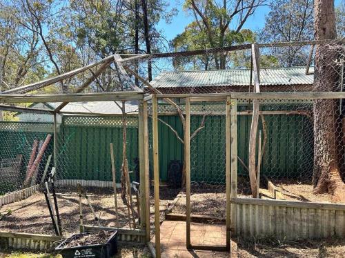 a batting cage being built in a zoo at Blue Mountains Ferncreek studio retreat pet friendly in Hazelbrook