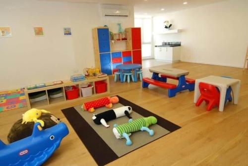a play room with toys on the floor at AXON Residence Kuala Lumpur in Kuala Lumpur
