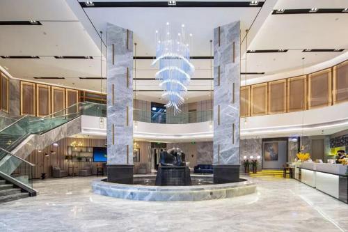 Vstupní hala nebo recepce v ubytování Echarm Hotel Wuzhou Wangcheng Plaza Longmu Temple Sanzongfu Branch