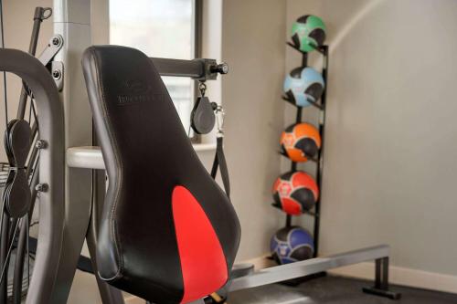 a room with a gym with a chair and balls at Days Inn by Wyndham Carbondale in Carbondale