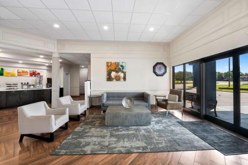 a living room with a couch and chairs at Quality Inn & Suites Fayetteville I-95 in Fayetteville