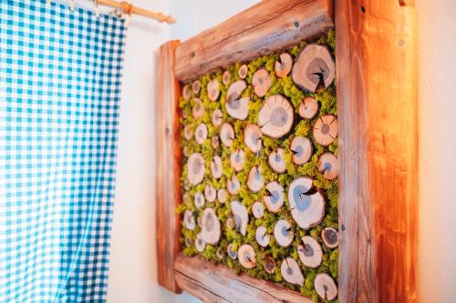 a beehive with mushrooms and moss in a wooden frame at Podklášterský domek in Třebíč
