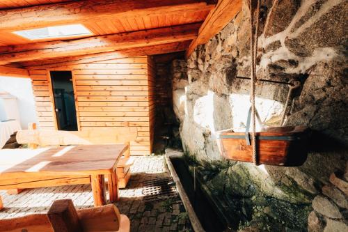 a wooden cabin with a table and a sink at Podklášterský domek in Třebíč