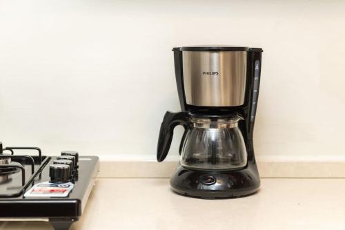 a blender sitting on a counter next to a stove at Maison Chic - Newly Renovated 3Br in City Center in Istanbul