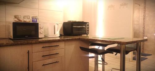 Kuchyň nebo kuchyňský kout v ubytování Ceelee's Place