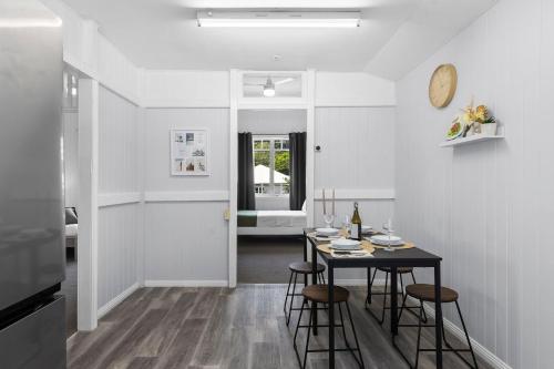 a dining room with a table and stools at Wow Bridge views Near CBD Quiet bus train in Brisbane