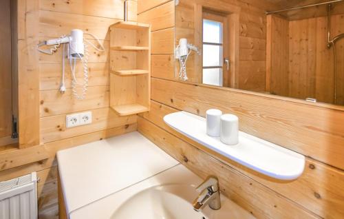 a bathroom with a sink and a mirror at Ferienhaus Donau 102 in Hayingen