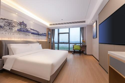 Fotografie z fotogalerie ubytování Yilong Michael International Hotel Suzhou Industrial Park Nanhuanqiao Market Branch v destinaci Jiangtian