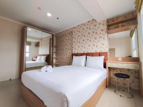 Ένα ή περισσότερα κρεβάτια σε δωμάτιο στο Cozy 2BR Apartment at Gateway Pasteur By Travelio