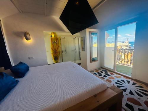 a bedroom with a bed and a view of the city at Villa Stars Seaview Corralejo in Corralejo