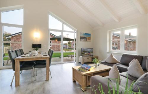 a living room with a couch and a table at Beautiful Home In Dagebüll With Wifi in Dagebüll