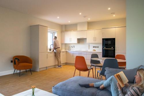a man standing in a kitchen in a living room at The Maltings in Portlaoise