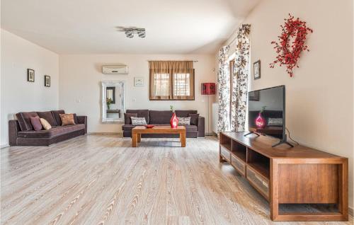 A television and/or entertainment centre at Amazing Home In Kokari