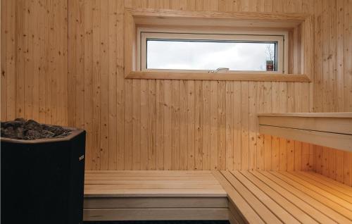 a room with a sauna with a window at Three-Bedroom Holiday Home Holmsjö With A Fireplace 06 in Holmsjö