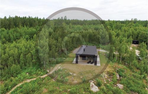 an overhead view of a house in the middle of a forest at Beautiful Home In Holmsjö With Sauna in Holmsjö