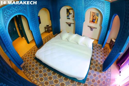 a room with a bed in a house at Layali Al Shams Hotel in ‘Anjar