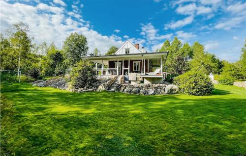 a house with a green lawn in front of it at Gorgeous Home In Laholm With Kitchen in Laholm