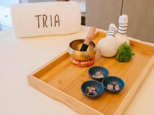 a wooden tray with some food on a table at MGM Shanghai West Bund in Shanghai