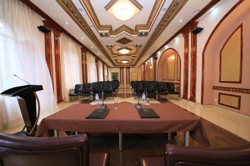 a conference room with a table and chairs at Borjomi Palace Health & Spa Center in Borjomi