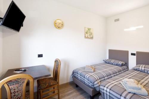 Ένα ή περισσότερα κρεβάτια σε δωμάτιο στο Gino