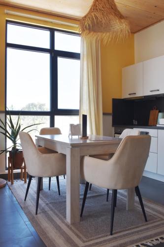 a dining room with a table and chairs at Nafsi Nomad in Paje
