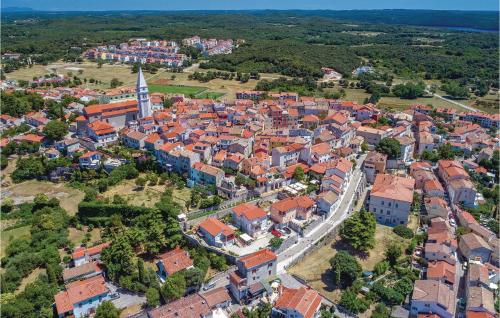 an aerial view of a town with red roofs at Lovely Home In Funtana With Sauna in Funtana