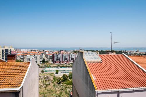 a view of a city with buildings and roofs at Lisbon Guesthouse in Lisbon