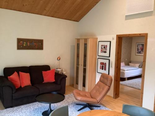 a living room with a couch and a bedroom at Landleben - Ferienhaus 1 in Fritzlar