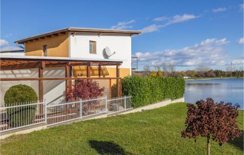a house with a view of a lake at Ferienhaus Mit Seepanorama in Rauchwart im Burgenland