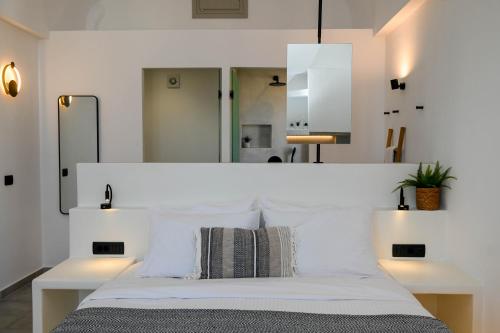Un ou plusieurs lits dans un hébergement de l'établissement Maeva Suites Santorini
