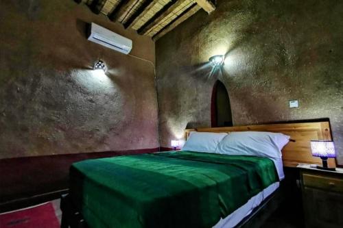 Ein Bett oder Betten in einem Zimmer der Unterkunft Riad Dar Zaouia
