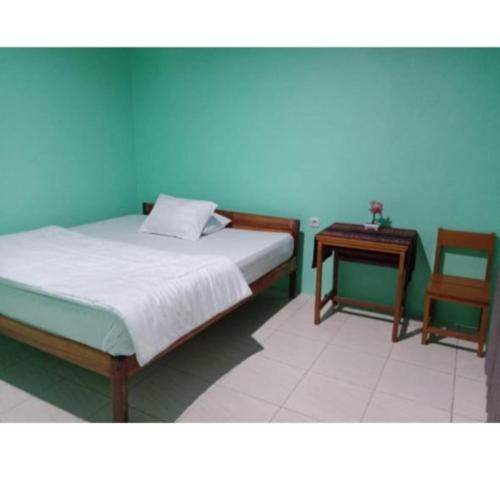 Ένα ή περισσότερα κρεβάτια σε δωμάτιο στο Rice field guest house