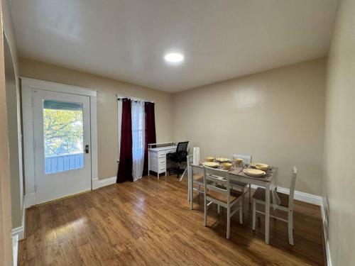 a dining room with a table and chairs at Ferry Getaway Home! in Niagara Falls