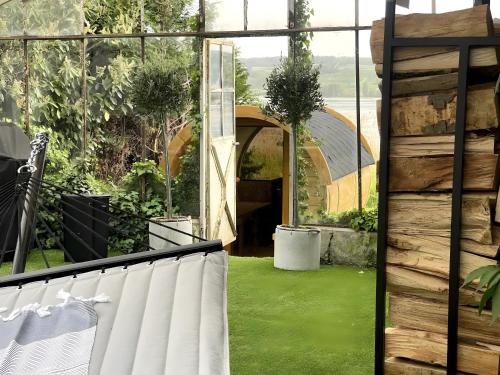 a view of a garden from the balcony of a house at Seezauber direkt am Wasser in Reichenau
