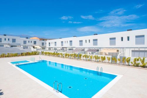 an image of a swimming pool in front of a building at MEDANO4YOU Lego House in El Médano