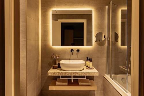 a bathroom with a sink and a shower at ME Malta by Meliá in St Julian's