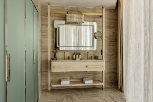 a bathroom with a sink and a mirror at ME Malta by Meliá in St Julian's
