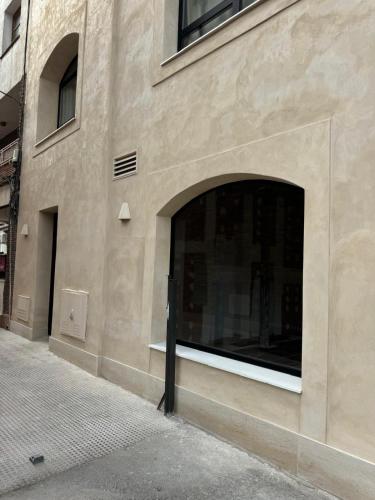 a building with a large window on the side of it at CASA MARTINA Apartamentos de diseño en Pozuelo in Pozuelo de Alarcón