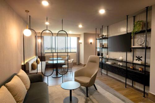 a living room with a couch and a table at Hilton Mexico City Airport in Mexico City