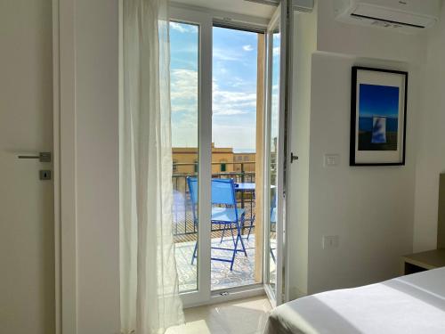 Ένα ή περισσότερα κρεβάτια σε δωμάτιο στο Palazzo Santa Maria